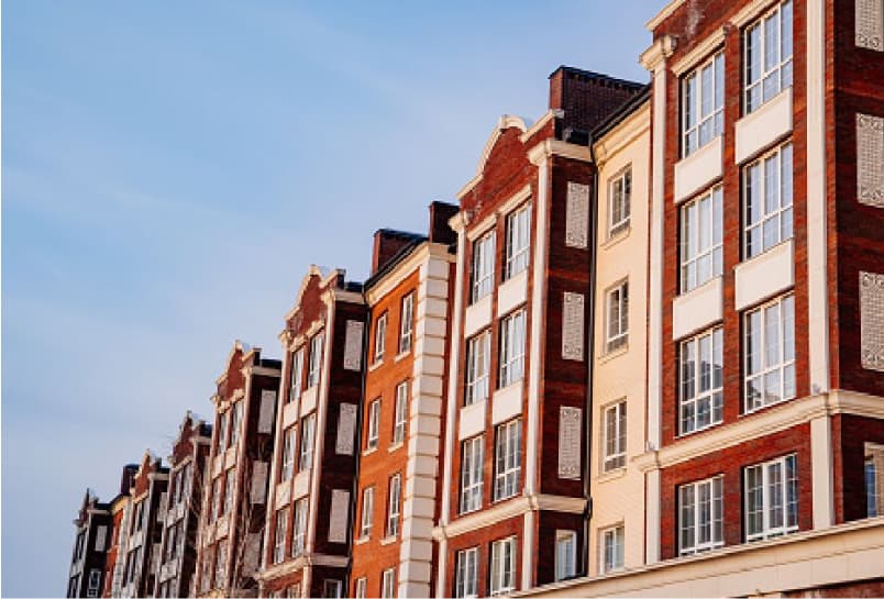 Image of a large block of apartment buildings.